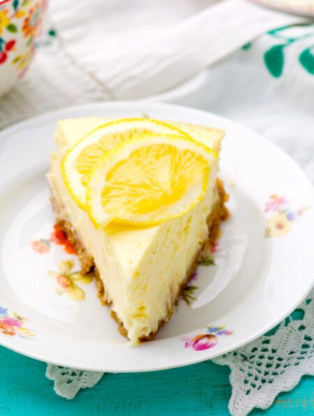 Close up image of lemon cheesecake on a decorative plate