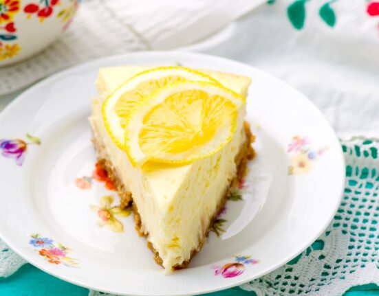 Close up image of lemon cheesecake on a decorative plate