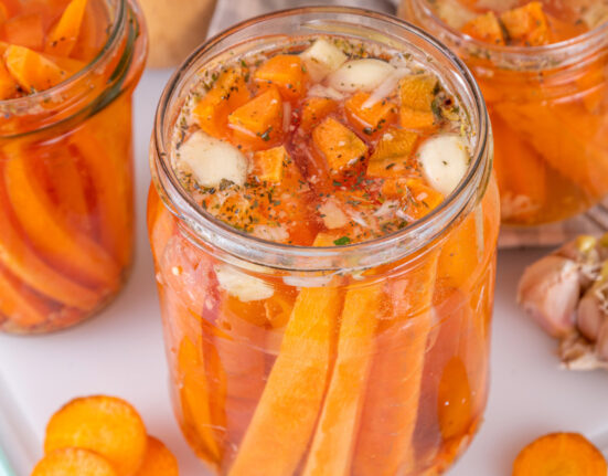 Pickled carrots in glass jars