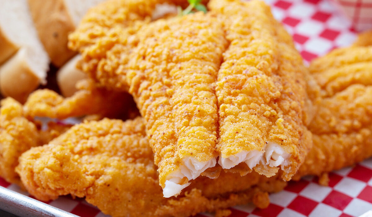 Close up image of air fryer catfish with a bite taken out of it