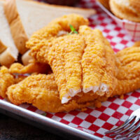 Close up image of air fryer catfish with a bite taken out of it