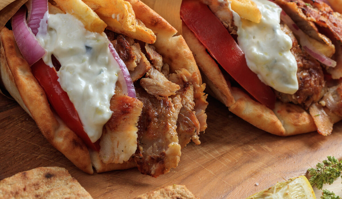 Two Chicken Gyros wrapped in parchment paper