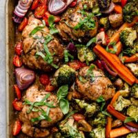 Overhead view sheet pan filled with balsamic marinated chicken and veggies