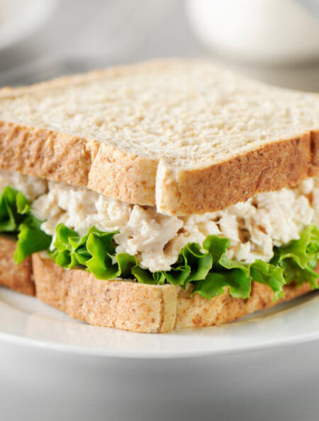 Tuna salad sandwich on a white plate