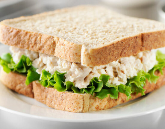 Tuna salad sandwich on a white plate