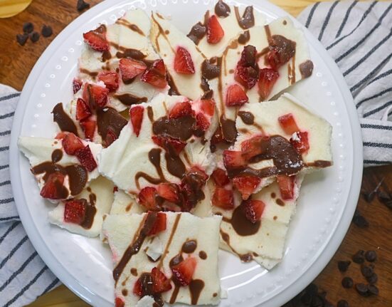 Overhead image of Chocolate Strawberry Yogurt Bark broken into pieces in a white bowl