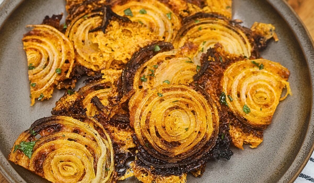 Overhead image of onion chips on a plate